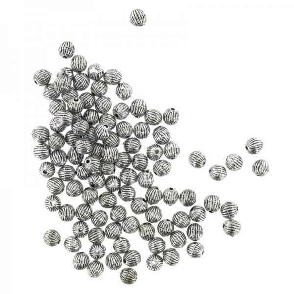 Small round plastic beads trough ancient silver 100 g